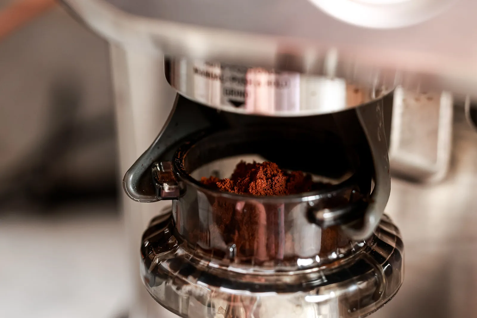 Freshly ground espresso in a portafilter on the espresso machine